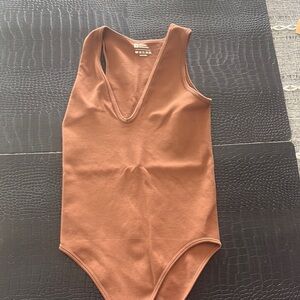 Brown Sleeveless Bodysuit with Deep V-Neckline